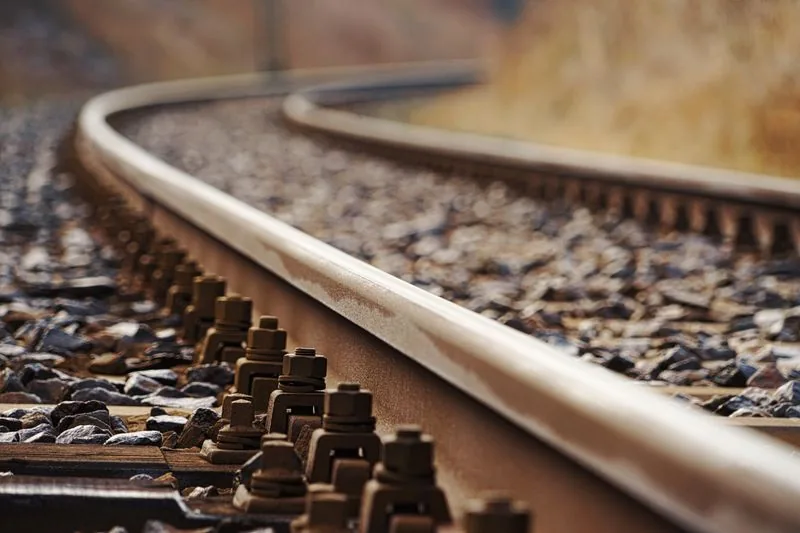 Close-up of steel railway rails on sleepers